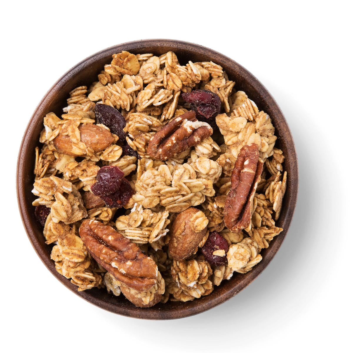 Bowl of granola with nuts and dried fruits on a white background