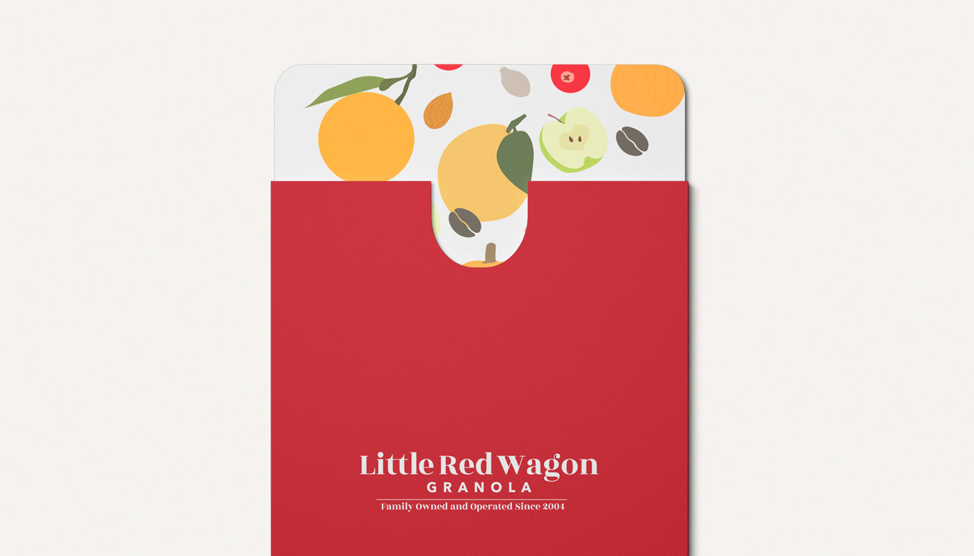 Red packaging with fruit illustrations and 'Little Red Wagon Granola' branding on a white background