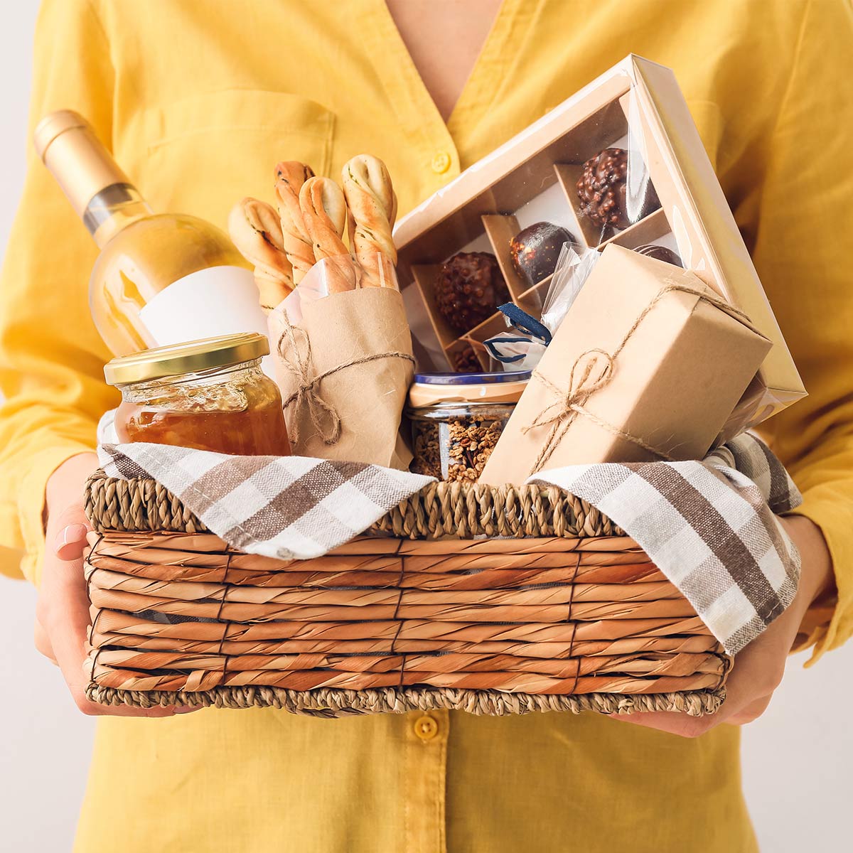 personalized mothers day gifts, woman holding gift basket