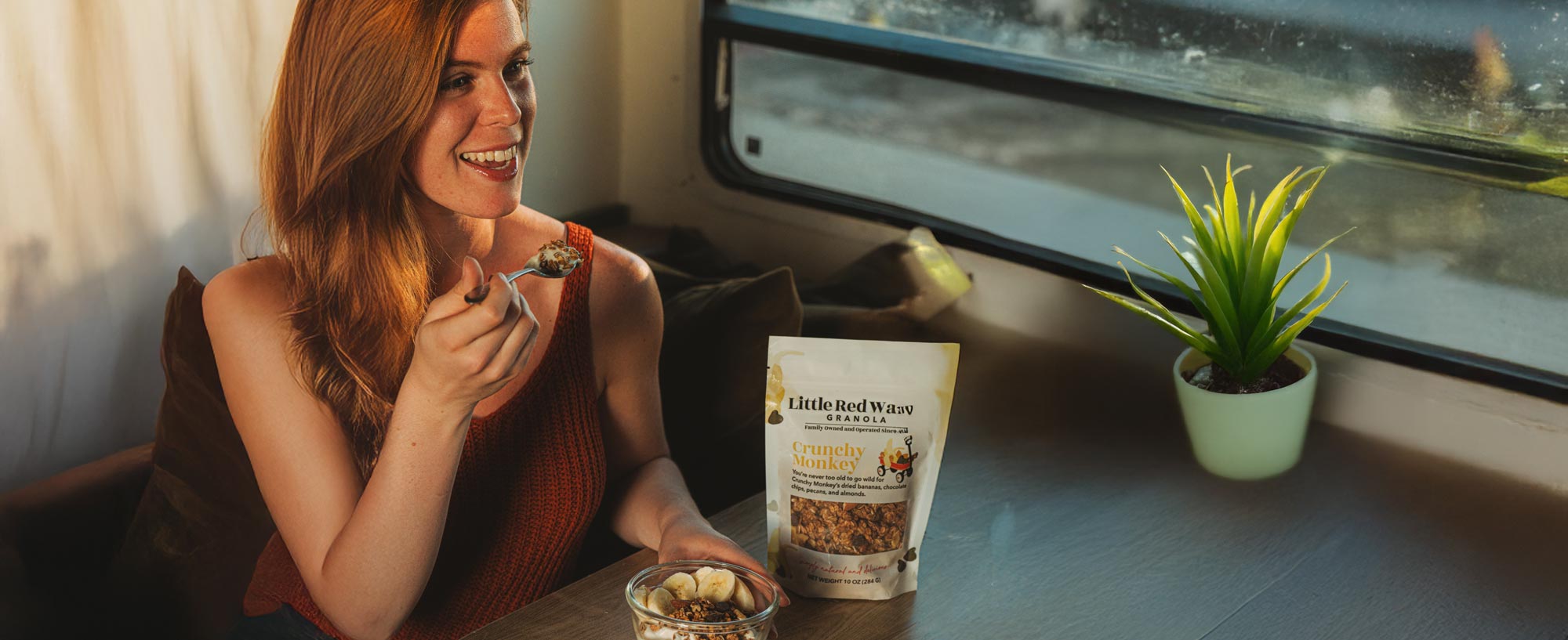 Woman eating Little Red Wagon Granola 