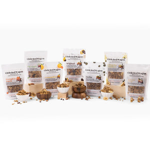 Assorted packages of Little Red Wagon pet food on a white background